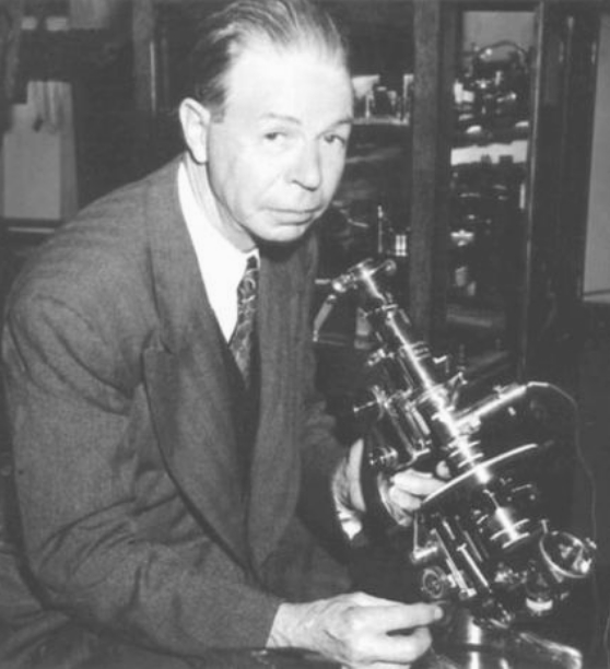 Dr. Royal Raymond Rife at his microscope